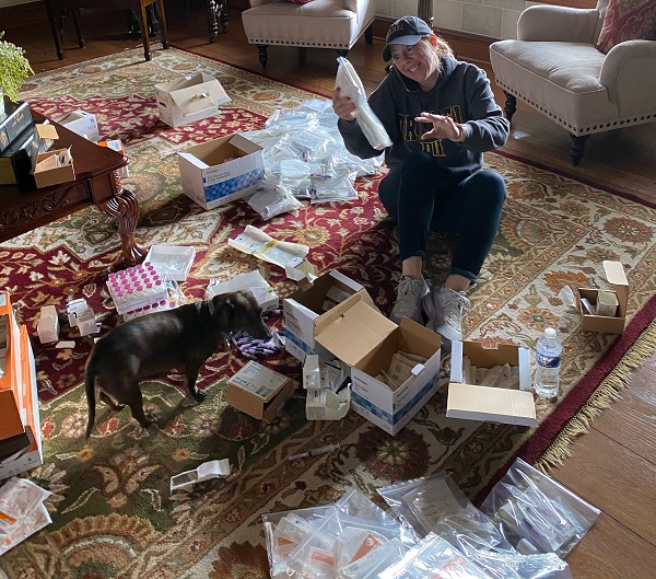 Jennifer Olszewski sorting through materials to pack student nursing bags